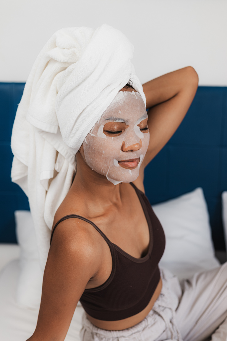 Woman with Towel and Skincare Face Mask
